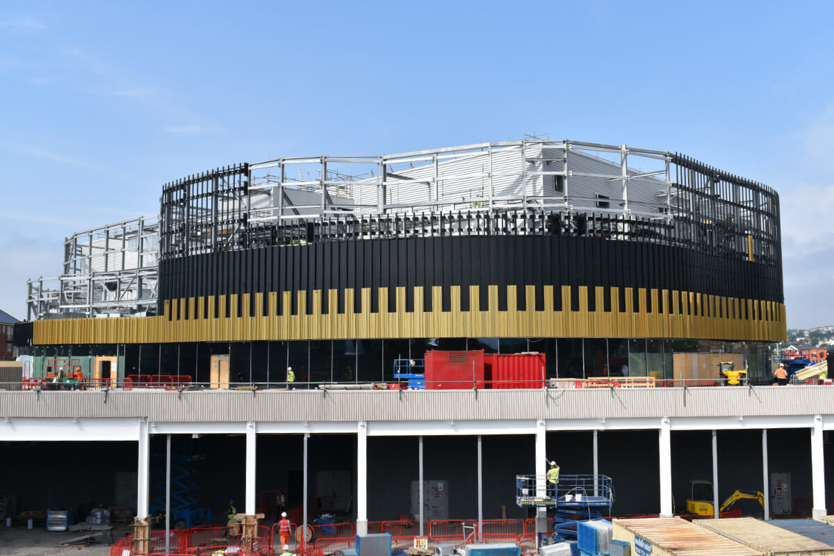 Installation of Arena gold panels